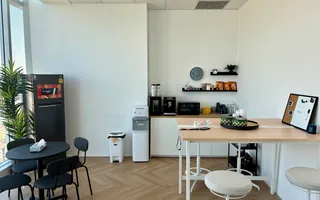 Pantry and kitchen area with a coffee station at the Azendo Bangkok office