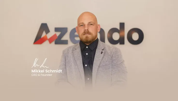 Mikkel Schmidt, CEO and founder of Azendo, in front of the Azendo logo