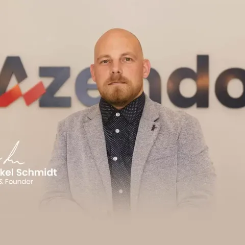 Mikkel Schmidt, CEO and founder of Azendo, in front of the Azendo logo