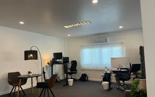 A lounge corner and workstations at the Azendo office in Chiang Mai