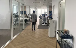 The Bangkok office floor where our offshore teams work, the Azendo screen at the end