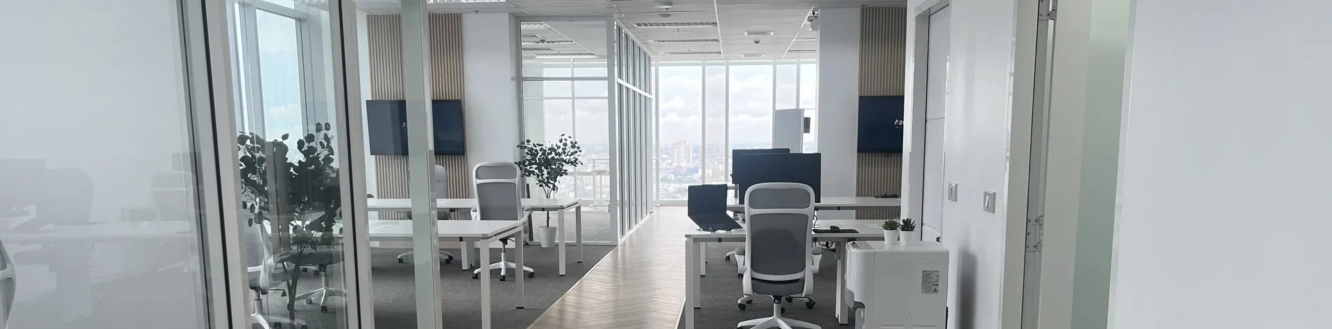 Desks at the Azendo Bangkok office, where our outsourced software development services are delivered