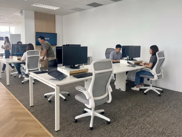 A dedicated development team at their desks in the Azendo Bangkok office