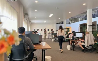 Dedicated developers at their desks on the Chiang Mai office floor