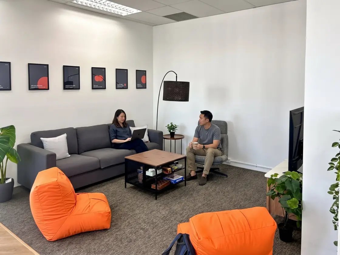 Two Azendo team members talking at a table in Chiang Mai, the values in practice