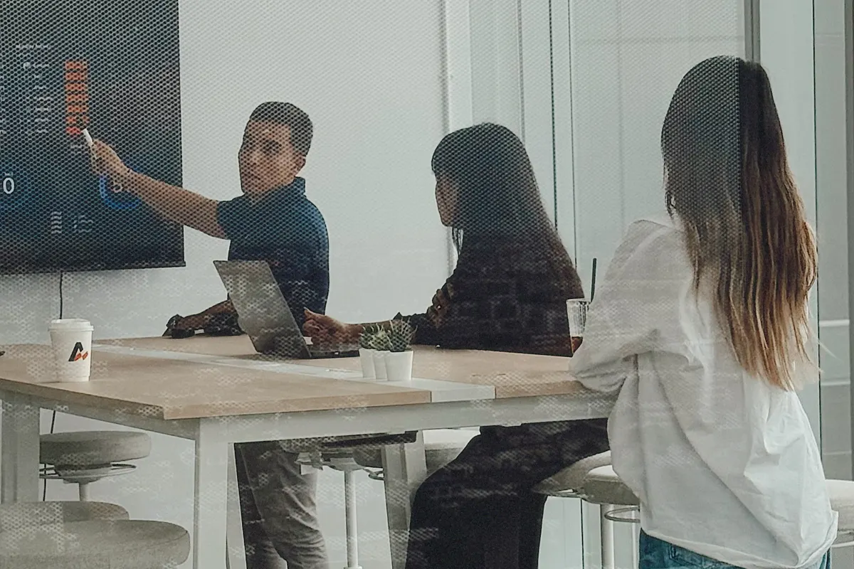 A developer walking colleagues through a chart, the review that follows a PHP security update